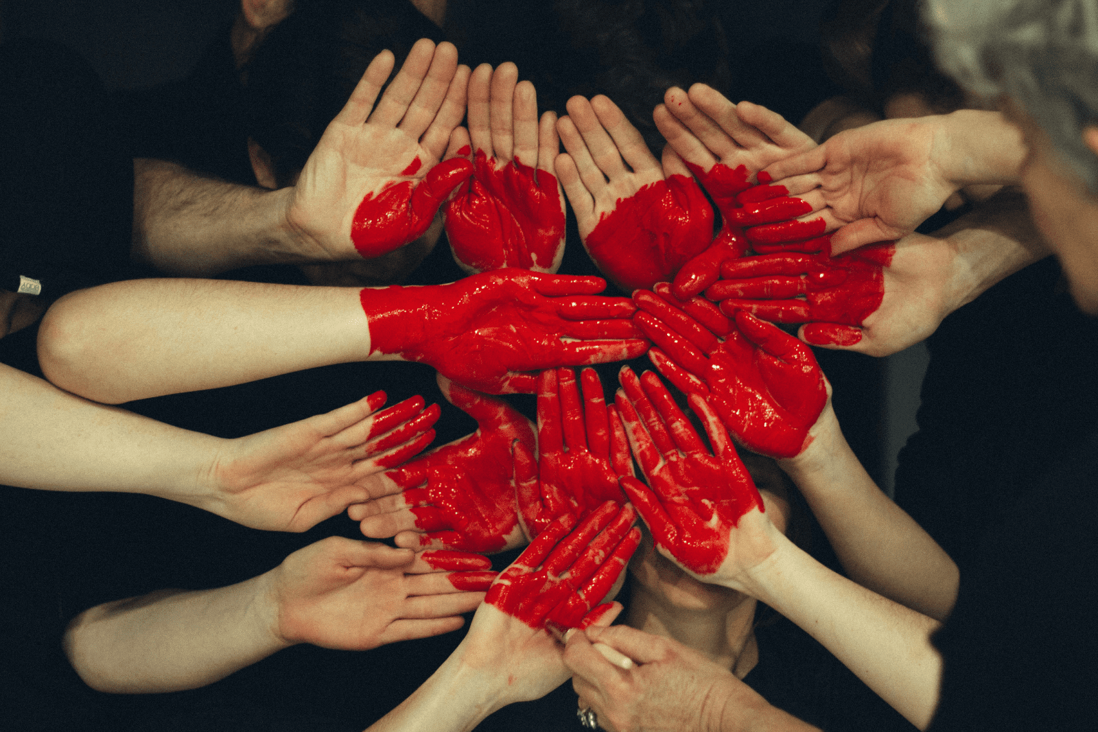 hand joined together with heart painted on them