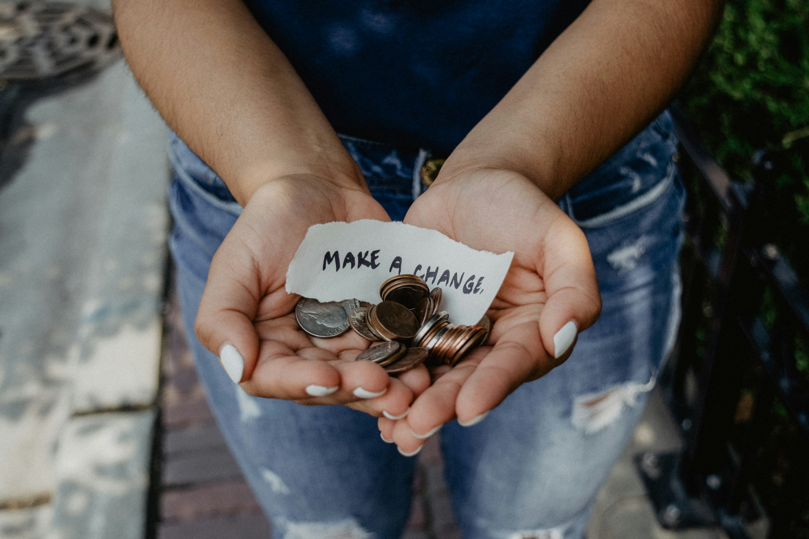 a person hold coins in her hand